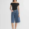 Publicité Short en denim sous le genou